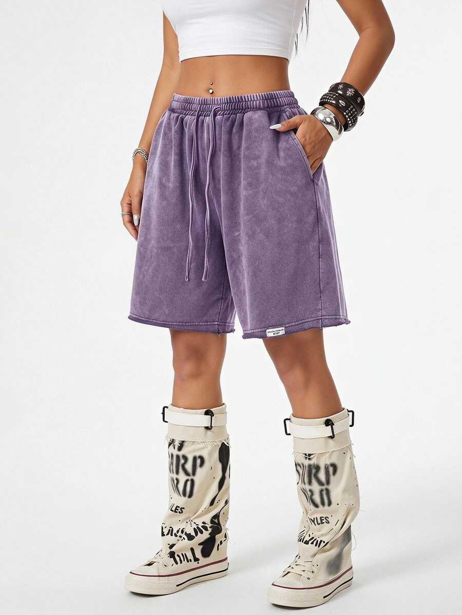 Women's loose fit dark grey track Bermuda shorts featuring an elastic drawstring waistband and side slit hem.
