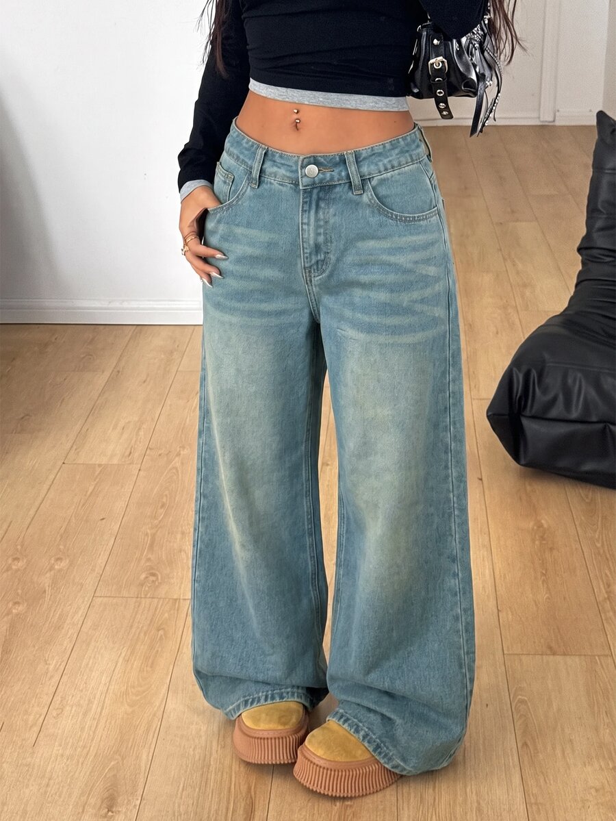 Women's loose wide-leg jeans in light wash denim with low waist and extra-long relaxed fit