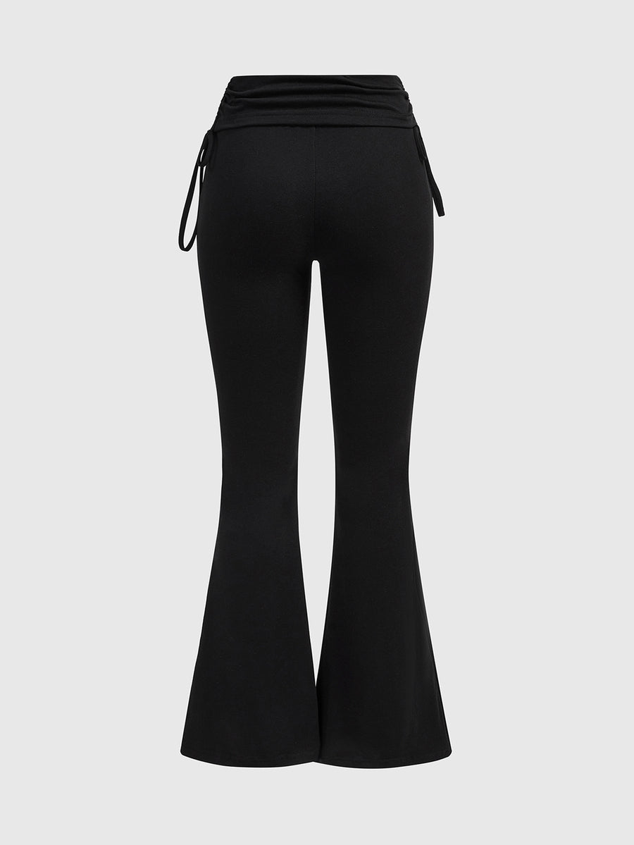 Women's low waist flare leg pants featuring an elastic drawstring waistband and ruched detail in knitted fabric.