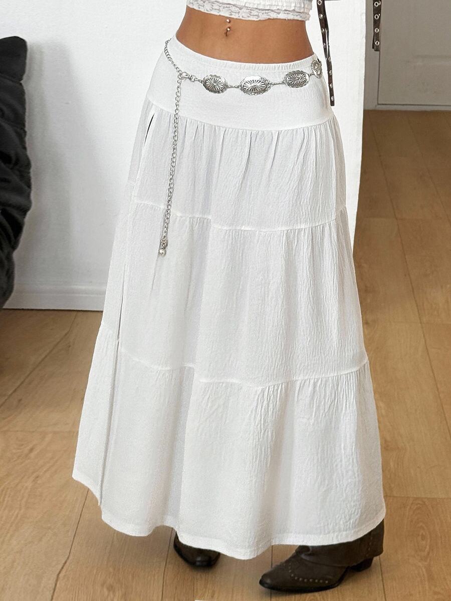 Women's red plaid long skirt featuring a low-rise waist and a side slit in lightweight woven fabric.