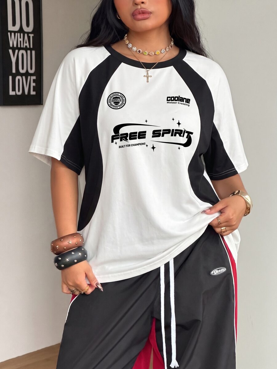 Unisex plus size oversized jersey t-shirt in brown featuring a round neck, short raglan sleeves with contrast binding, and a front letter graphic print.