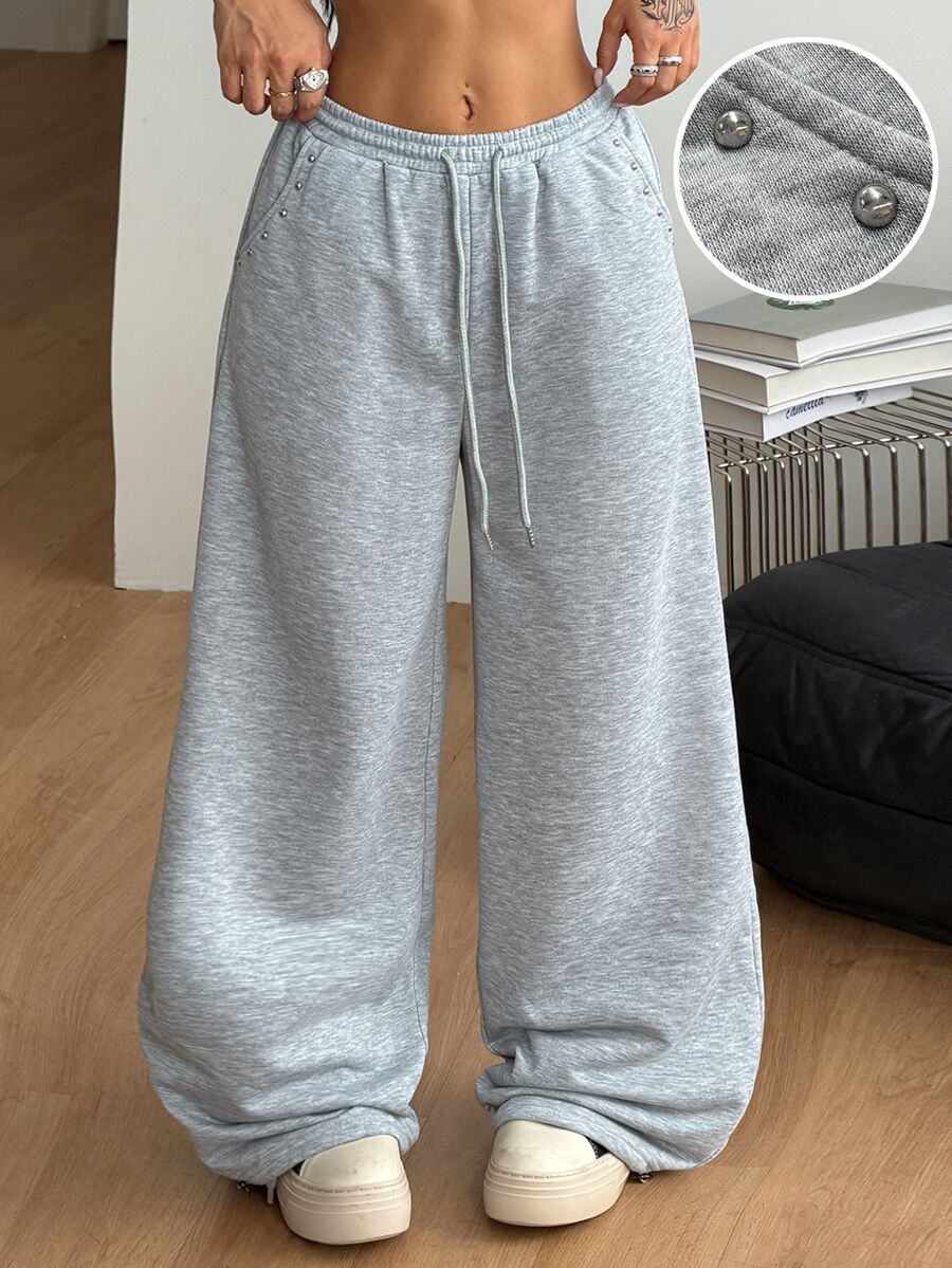 Women's loose fit wide leg graphic sweatpants in light grey with an elastic drawstring waistband