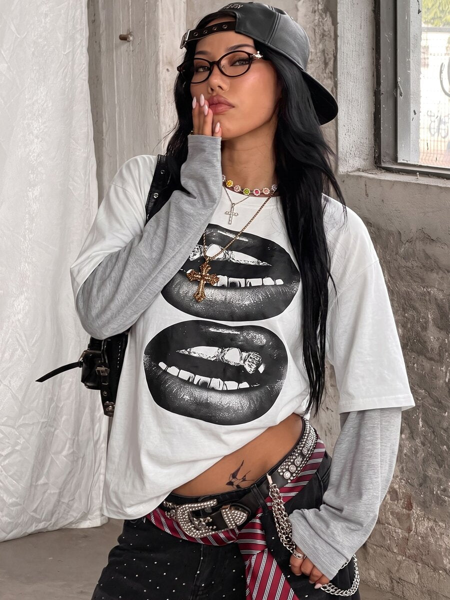 Women's casual graphic long sleeve t-shirt with a round neck, drop shoulder sleeves, and loose relaxed fit.