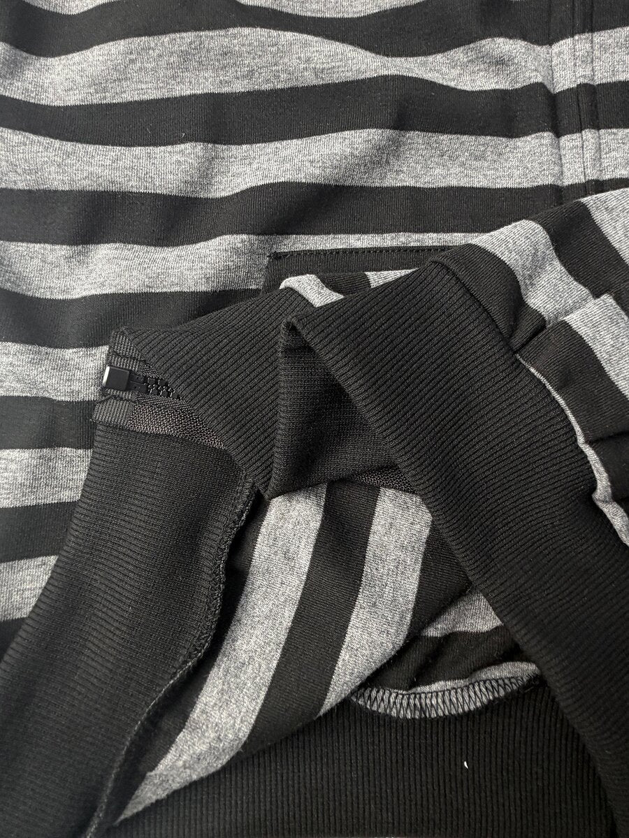 Women's oversized zip-up hooded sweatshirt featuring a striped pattern, drop shoulders, front pockets, and drawstring hood.