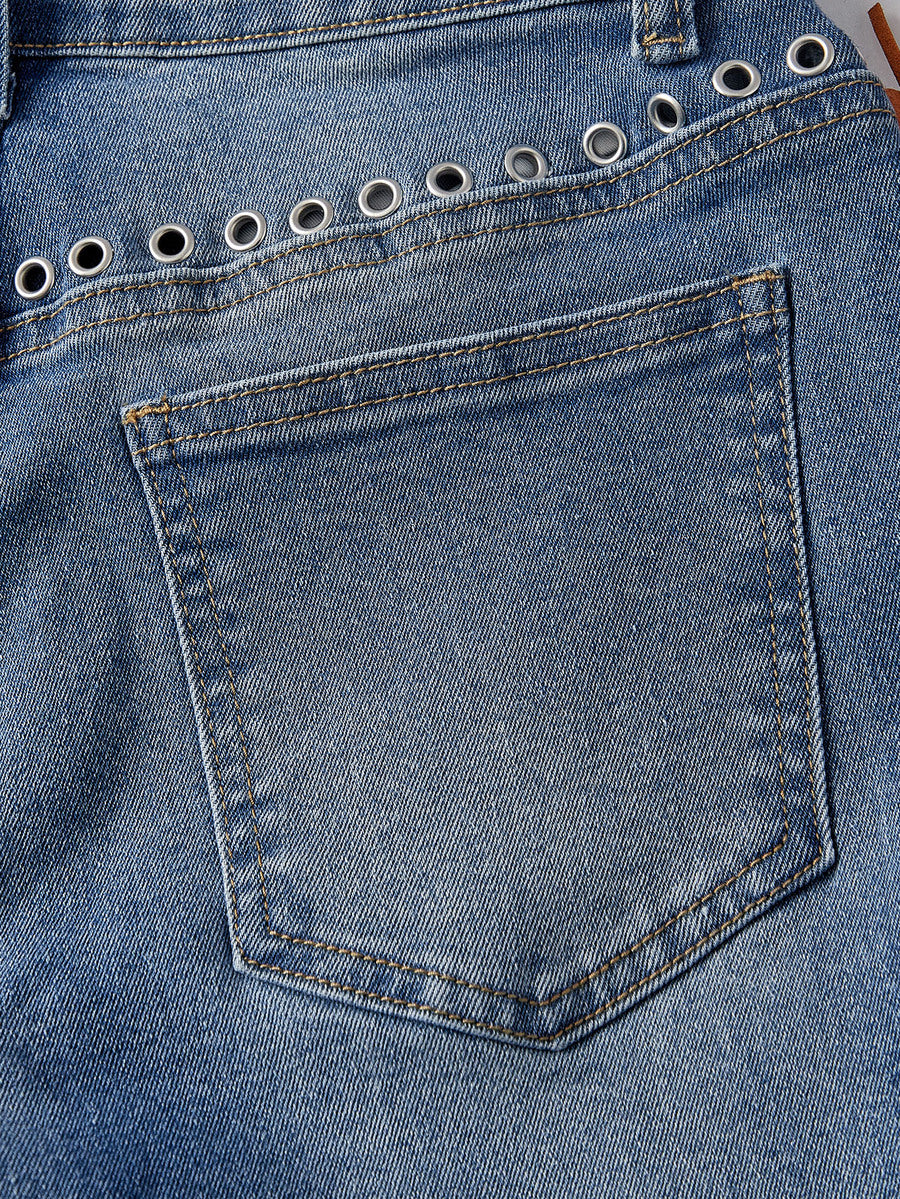 Women's ultra low waist flare jeans in washed stretch denim featuring an extra long bootcut leg and zipper fly closure.