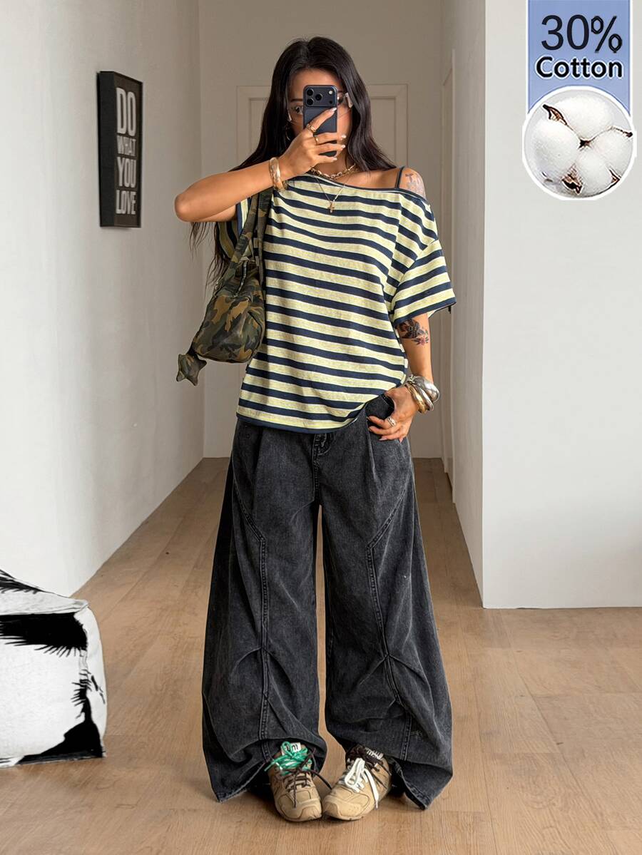 Women's casual loose fit cold shoulder cotton t-shirt with asymmetrical cutout neckline and short sleeves.