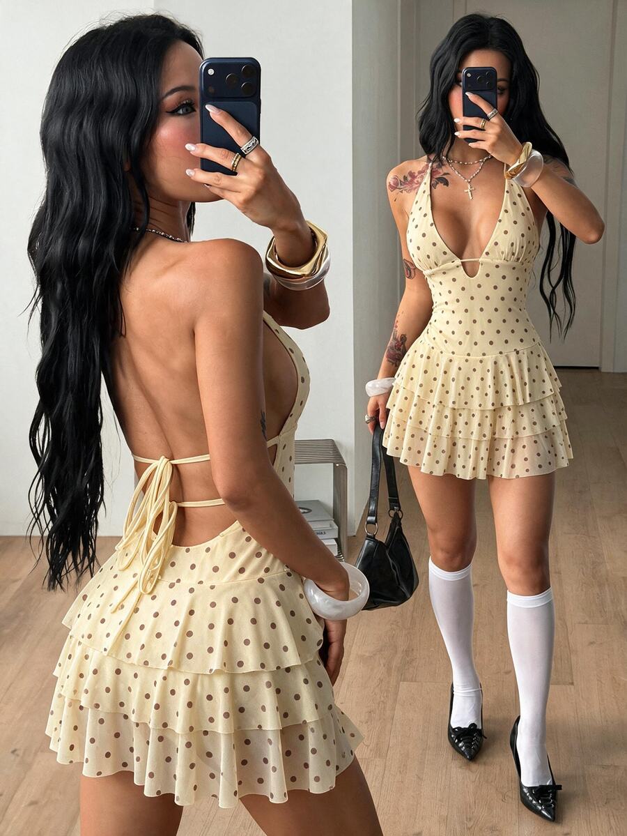Front view of a women's lace halter mini dress featuring a slim-fit bodice, flared hem, and sleeveless design.