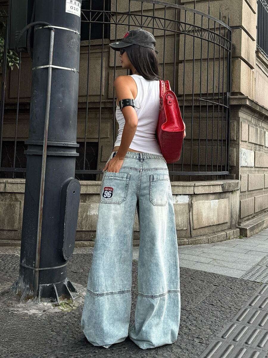 Women's loose wide-leg jeans in light wash denim with low waist and extra-long relaxed fit